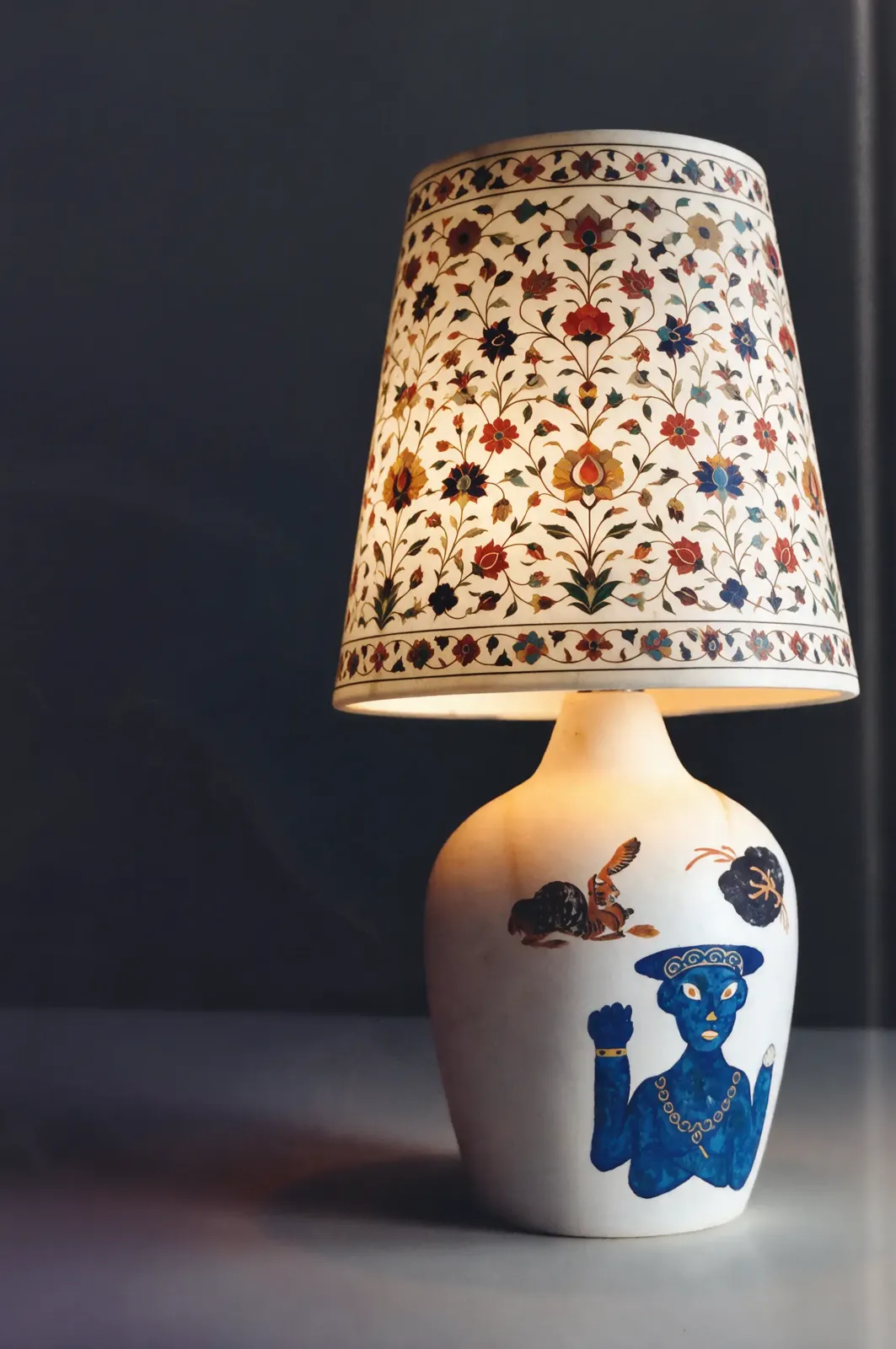 Inlaid lamp with a blue figure